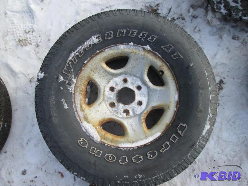 lot 31 image: Rim with mounted Firestone Wilderness AT P265...