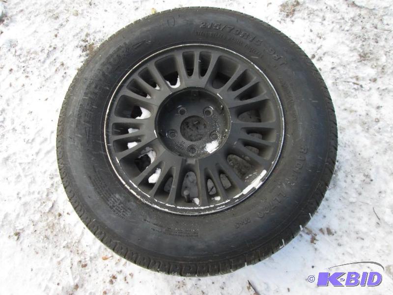 lot 38 image: Rim with mounted epic tour tire, 21570 R15 9...