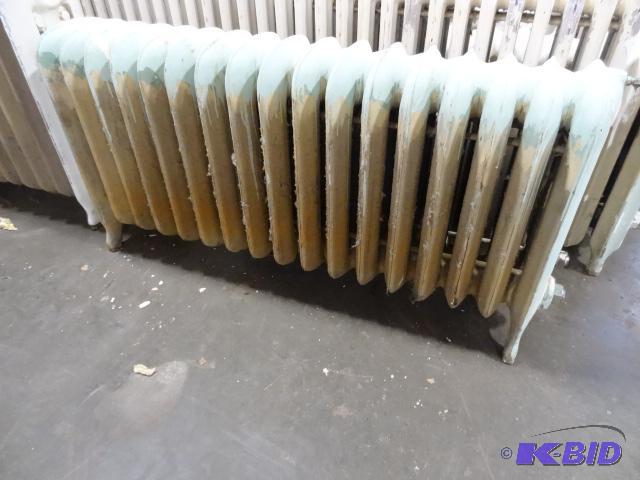 lot 23 image: 17 Fin Cast Iron Radiator 49 X 9 X 22...