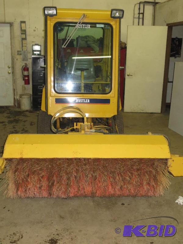 Hustler snow machine with blower and broom. G...
