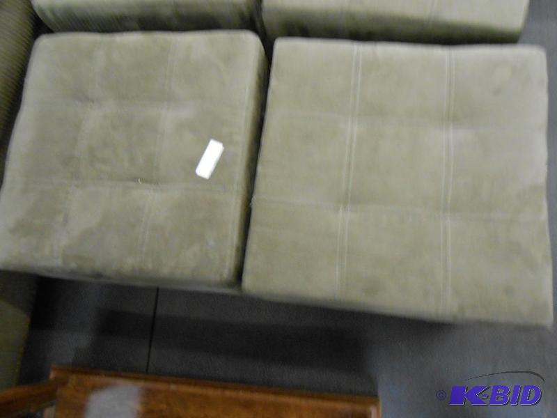These compact green ottomans are good condition.