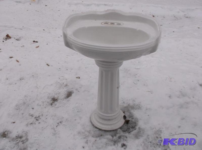 Porcelain Pedestal Sink appears in good usabl...