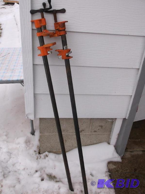 lot 36 image: 2 Pony 48" pipe wood clamps....