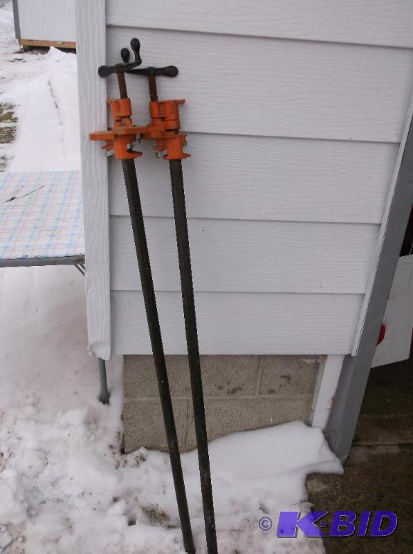 lot 37 image: 2 Pony 48" pipe wood clamps....