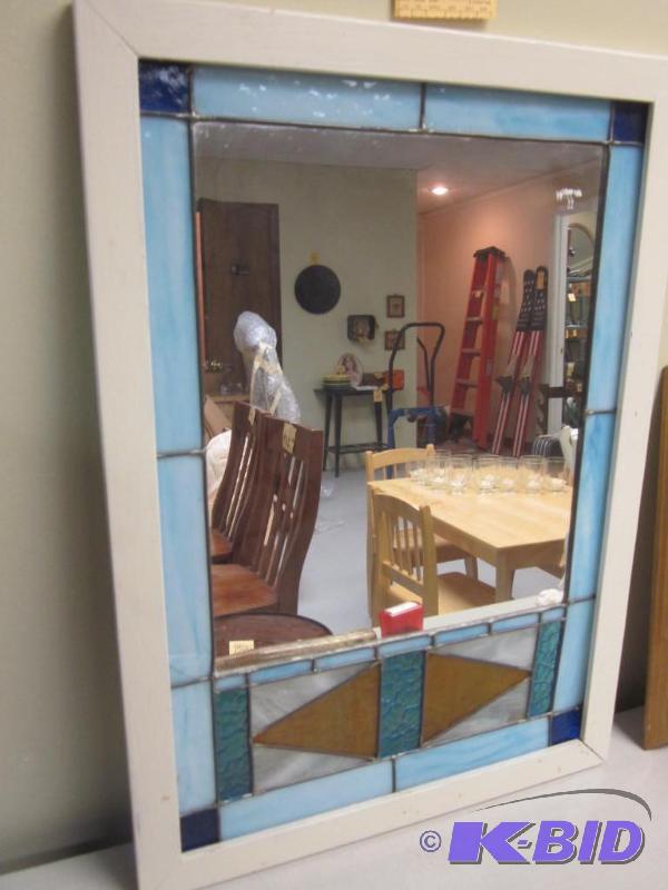 lot 131 image: Stained and leaded glass mirror in wood surro...