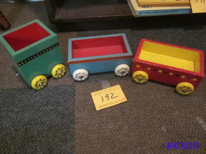 lot 192 image: Lot of (3) painted solid wood toy train cars....