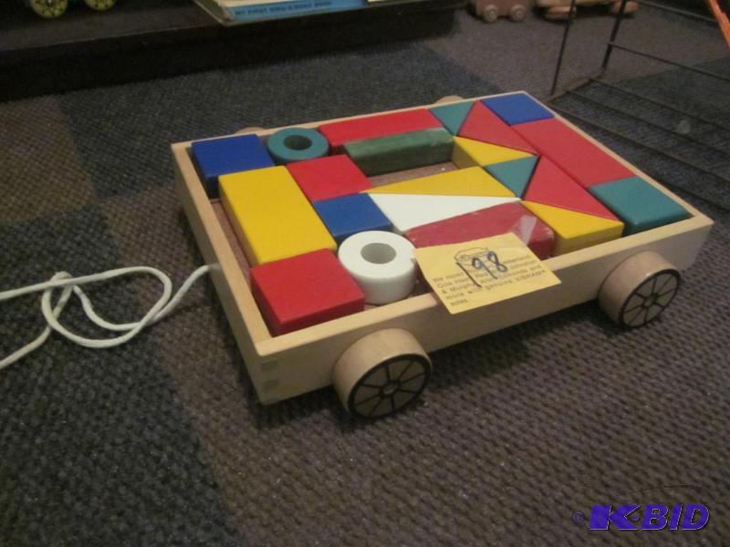 lot 198 image: Solid wood mini child pull wagon filled with ...