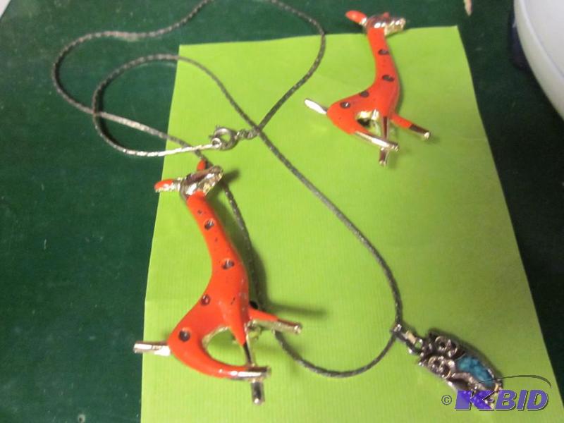 lot 234 image: Pair of giraffe pins and owl necklace.  ...