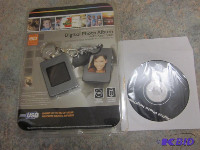 lot 247 image: Digital photo album key chain in package with...