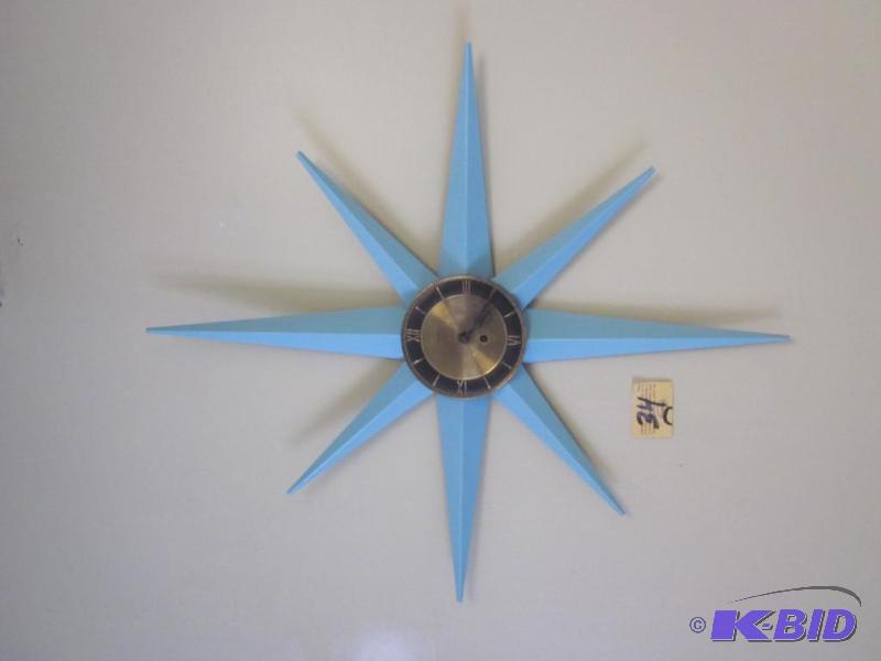 lot 34 image: Eames Era Atomic Sunburst metal clock, painte...