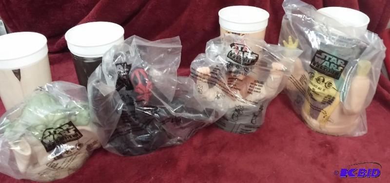 lot 154 image: LOT OF 4 CUPS WITH CUP TOPPERS....