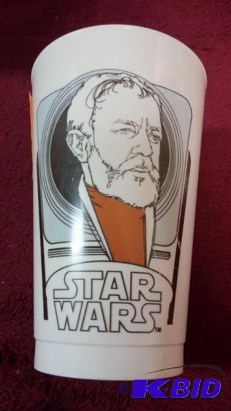 lot 45 image: VINTAGE COCA-COLA PLASTIC CUP FEATURING OBI-W...