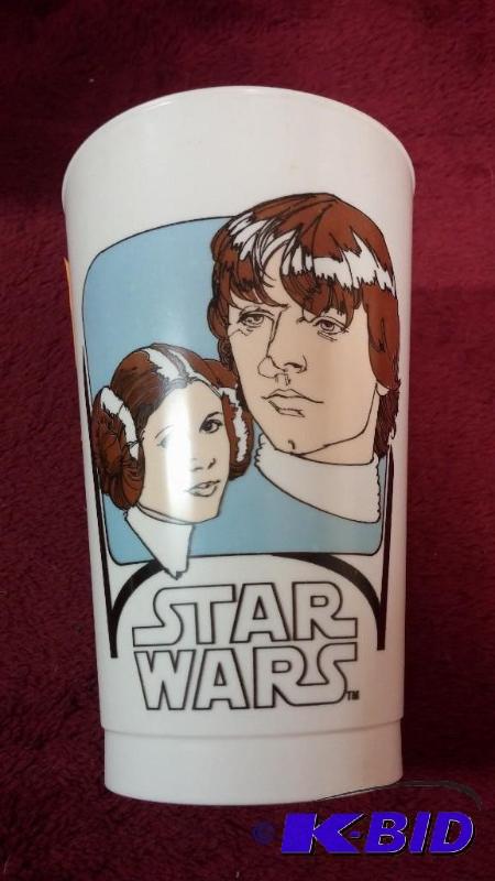 lot 46 image: VINTAGE COCA-COLA PLASTIC CUP FEATURING LUKE ...
