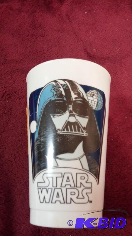 lot 65 image: VINTAGE COCA-COLA PLASTIC CUP FEATURING DARTH...