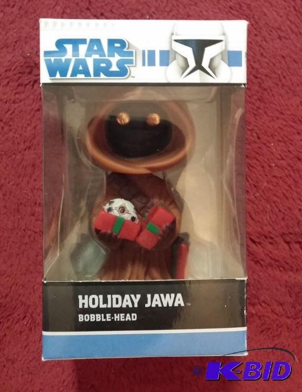 lot 77 image: HOLIDAY JAWA BOBBLE HEAD NEVER BEEN OPENED...