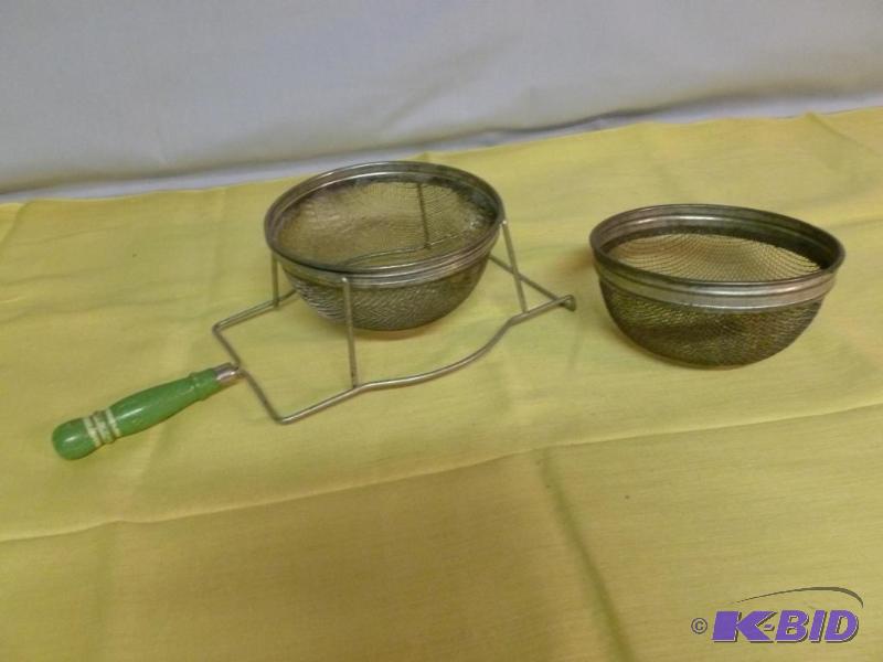 lot 108 image: Large vintage green wood handled strainer, co...