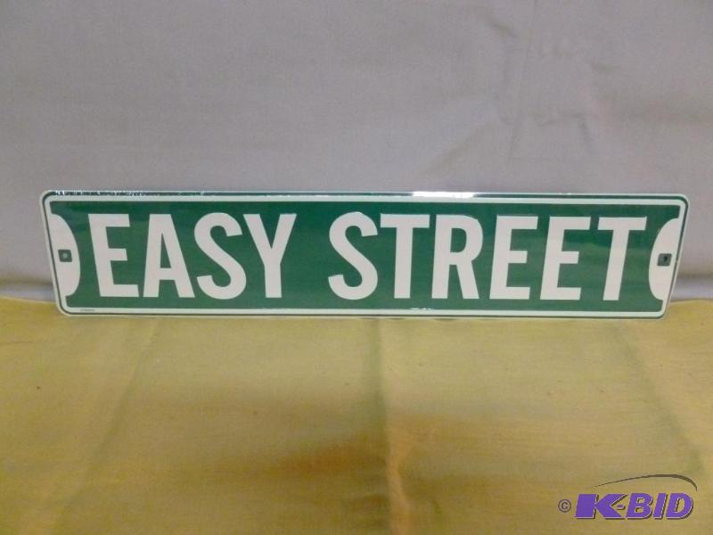 lot 129 image: Easy Street embossed metal sign that measures...