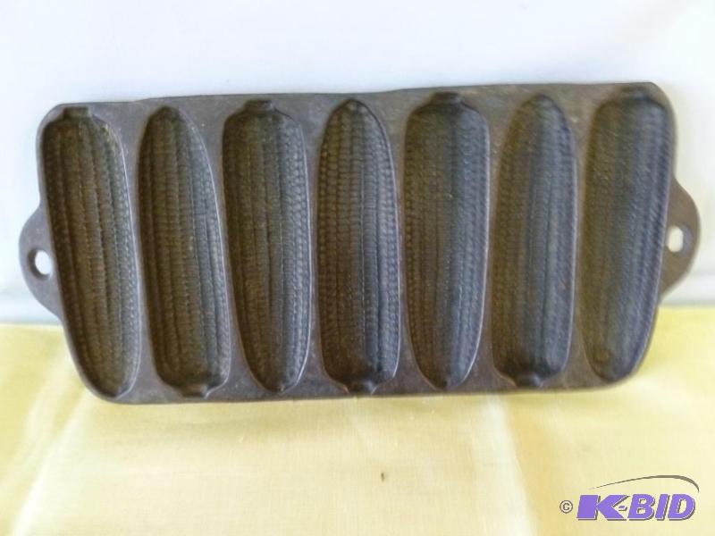 lot 210 image: Vintage cast iron corn bread pan that measure...