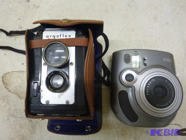 lot 105 image: Two Cameras...