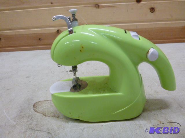 lot 137 image: Portable Battery Operated Sewing Machine...