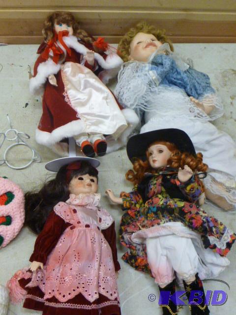 lot 22 image: Four Dolls...