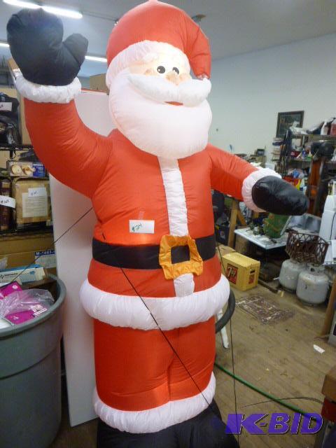 lot 24 image: Blow Up Santa Claus 8 feet tall....