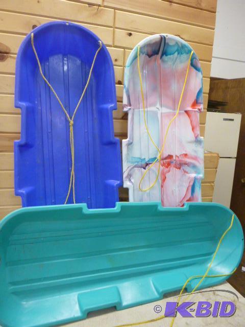 lot 92 image: Three 48" Plastic Sleds...