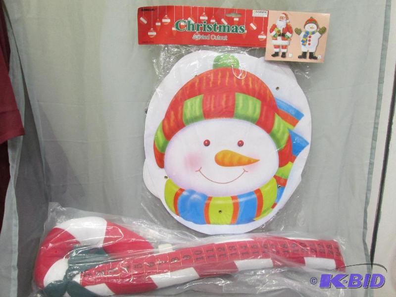 large wall cutout and stuffed candy cane...