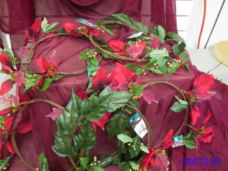 Round wreath with red flowers and gold berrie...