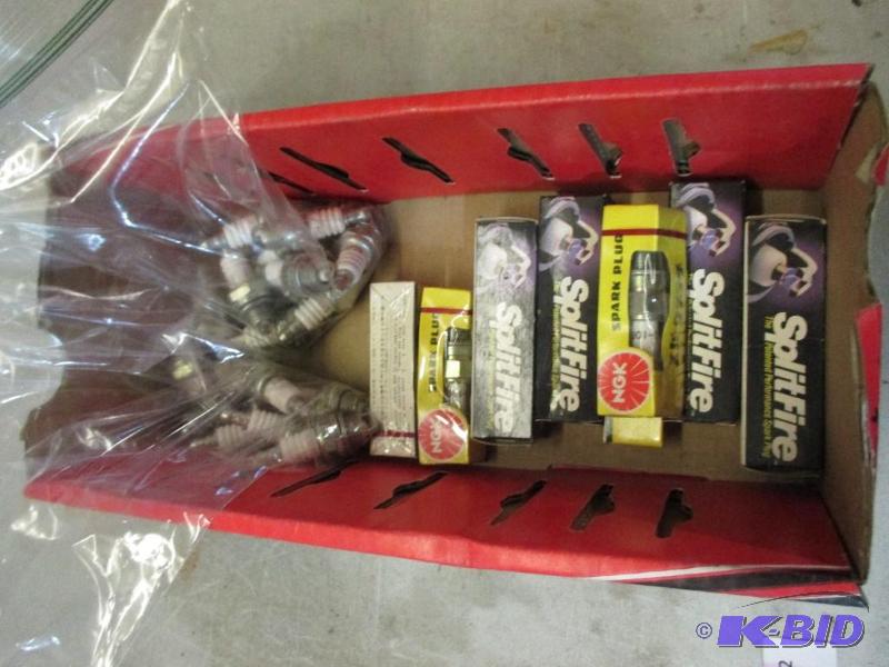 lot 73 image: box of new spark plugs...