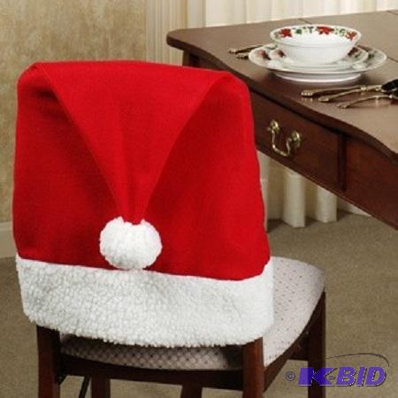 lot 19 image: Santa Hat Chair Covers - Santa Hat Chair Back...