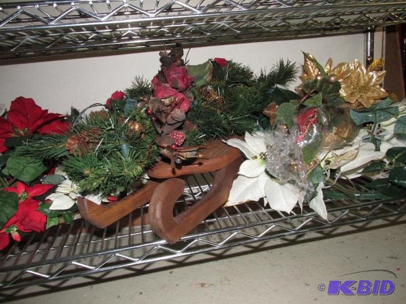 A Shelf full of WREATHS and a SLED with a Pretty Bow and Pine Cones