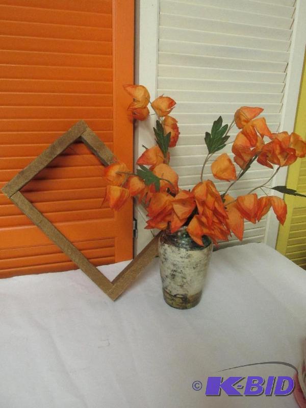 Hand-Thrown Pottery with Arrangement and a Rustic Wooden Frame.