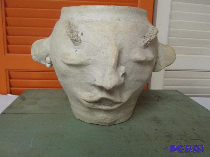 A Vase with a Face.