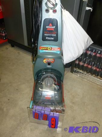 lot 9 image: Bissel pro heat carpet shampooer. Appears to ...