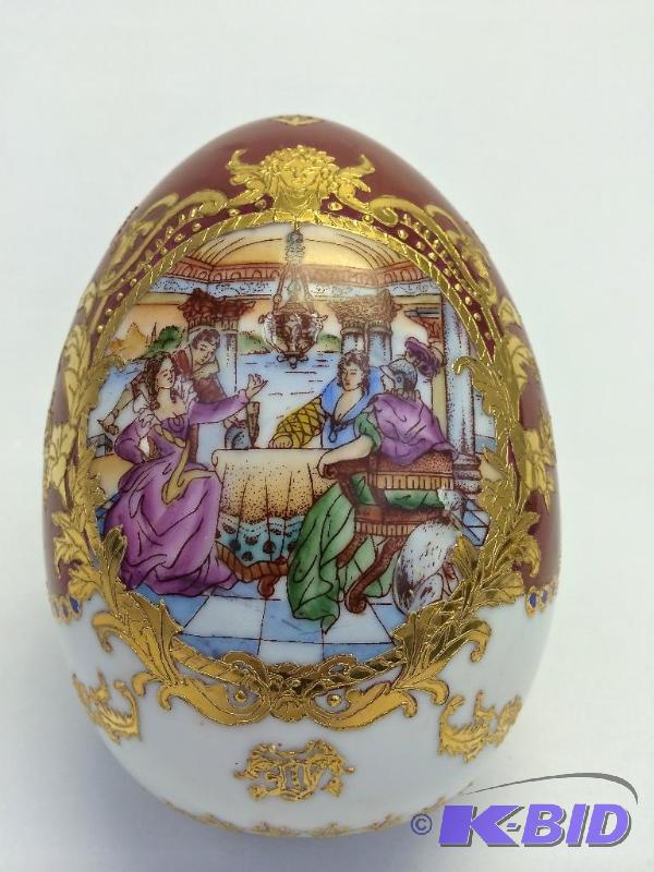 lot 16 image: fine porcelain large egg with 24 CT gold inlays