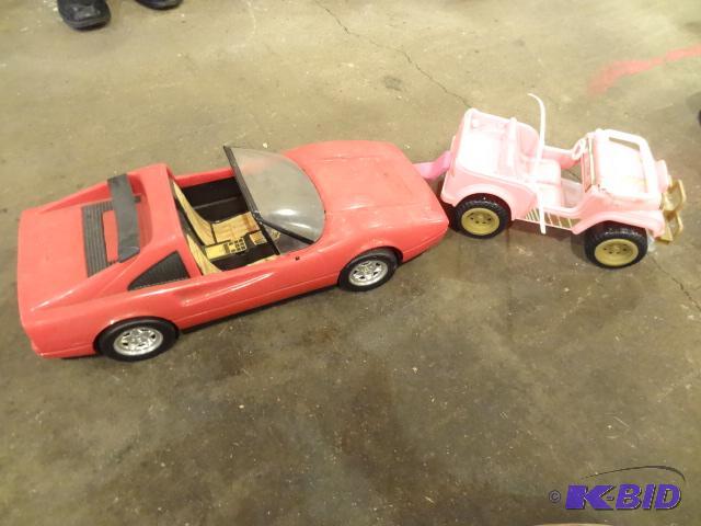 lot 146 image: Plastic Ferrari. Plastic Barbie Jeep...