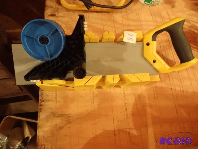 lot 25 image: Plastic Miter Box. Tape Dispenser. Miter Saw...