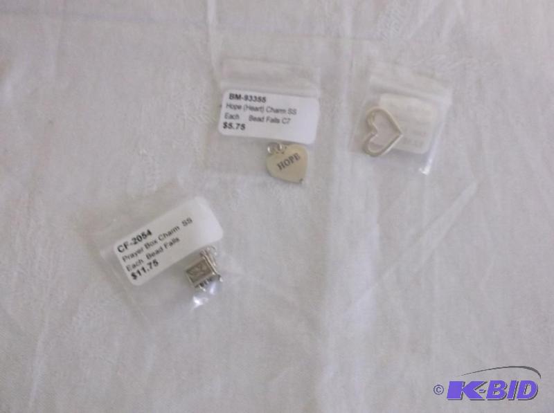 Lot of 3 Sterling silver charms....