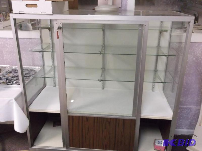 Glass locking showcase that comes with the ke...