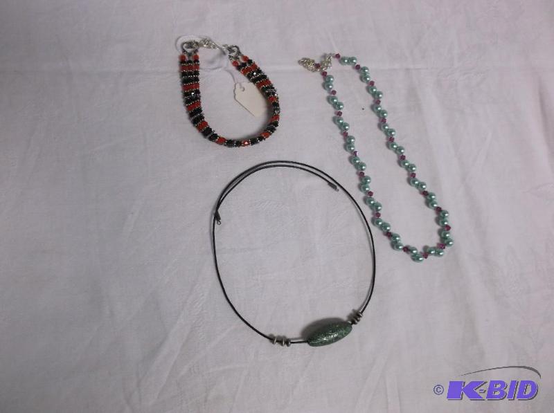 A Red  Black 4mm 3 strand Bracelet and A Lea...
