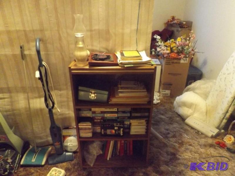 lot 123 image: Contents of Bookshelf, books, VCR tapes, oil ...