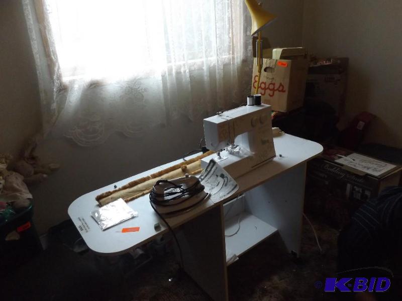 lot 144 image: Sewing machine, and iron...