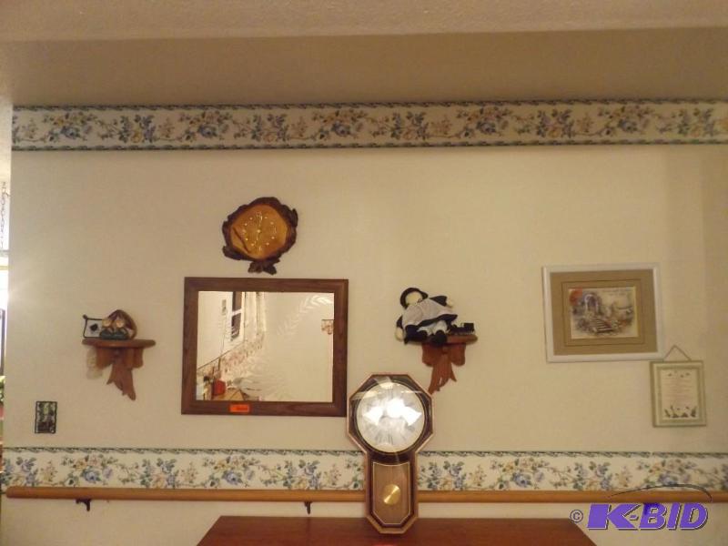lot 44 image: mirror clock 2 shelves with dolls on them fra...