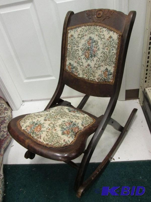lot 1 image: Folding rocking chair with padded upholstry. ...