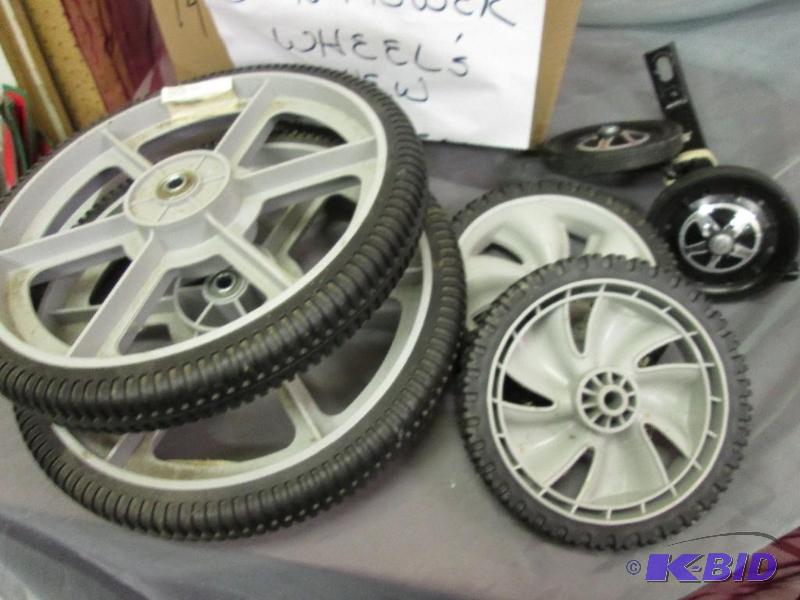 lot 38 image: Set of new lawn mower wheels and training whe...