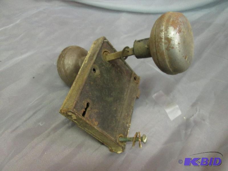 lot 44 image: Antique door knob set...