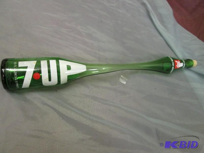 lot 48 image: Stretched 7 UP bottle...