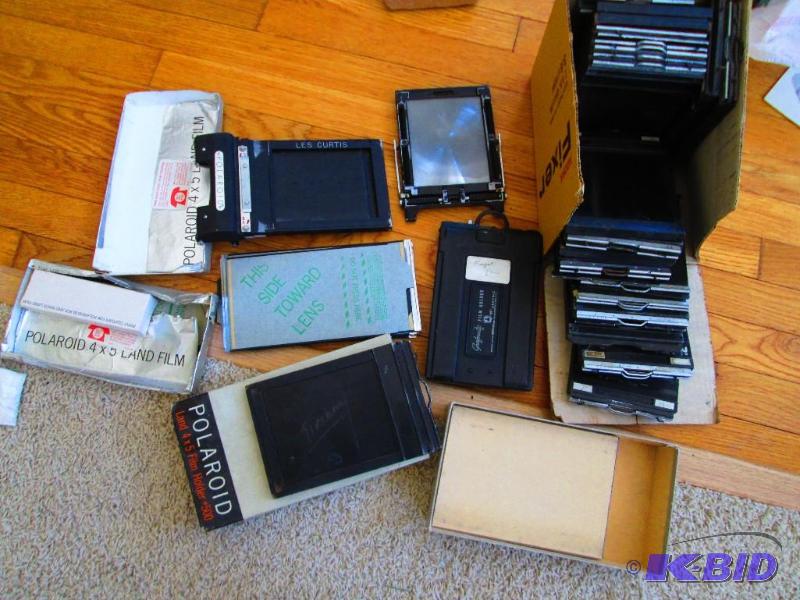 lot 83 image: Lot of assorted Polaroid film and film holder...