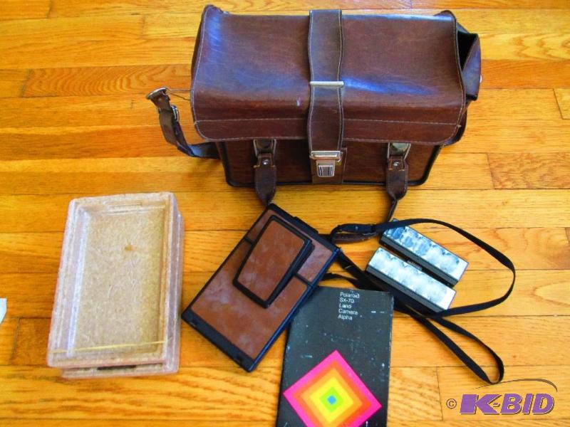 lot 84 image: Polaroid camera and case with instructions an...